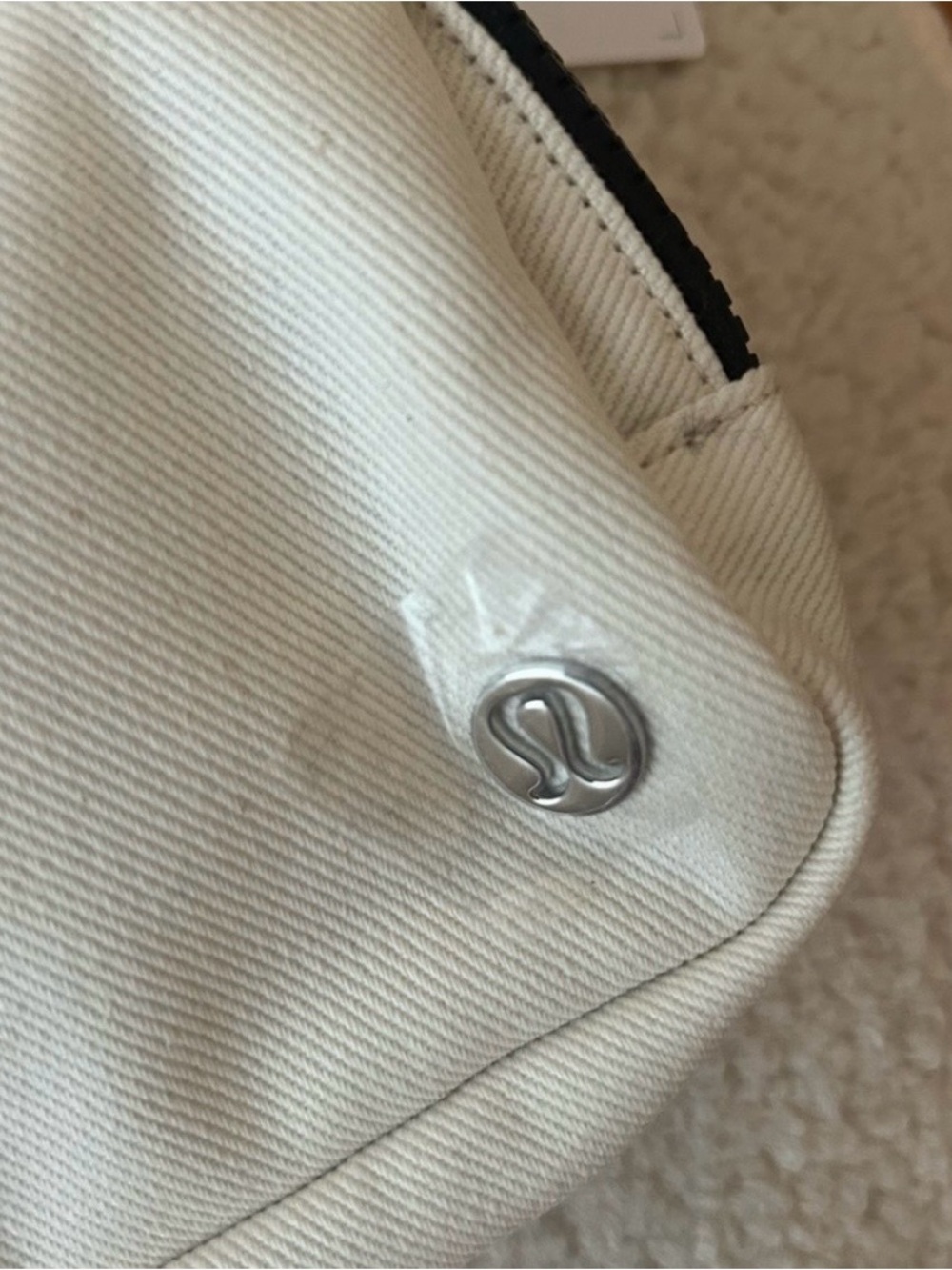 lululemon athletica mini bag in cream with black trim